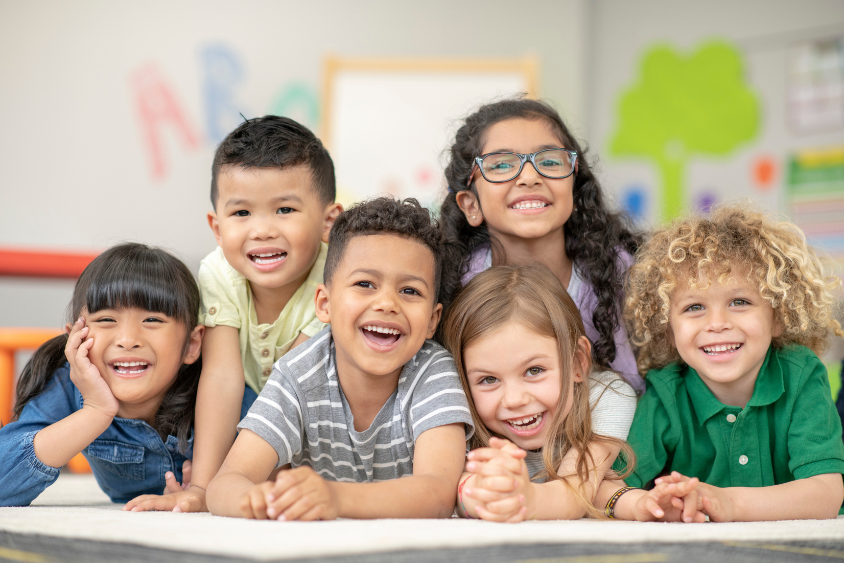 A group of smiling kindergarten students